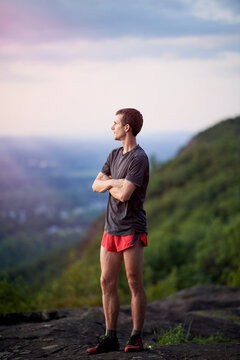 Portrait of a young adult man trail runner on a Mountain Ridge