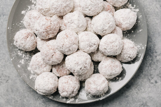 Plate of flour coated meatballs ready for cooking