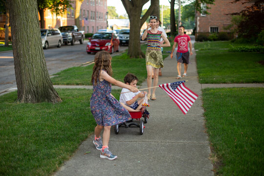 A family has a parade on the 4th of July