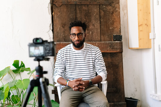A Black man recording in a video interview