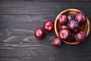 plums fruits natural products on a wooden table top view