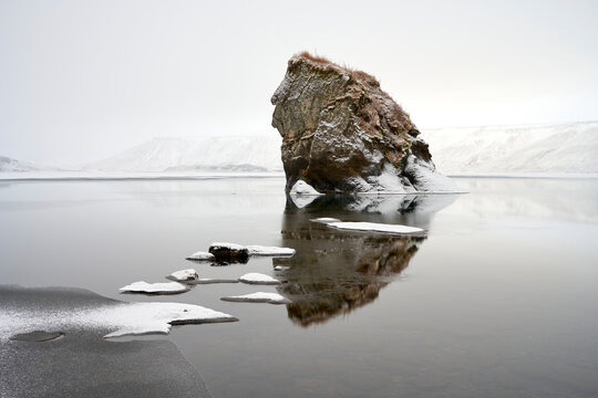 Snow covered ice chunks in cold lake
