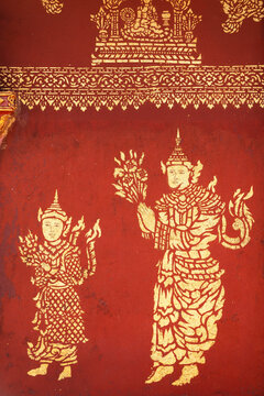 Architecture detail of Buddhist paintings on red wall of Dhart Zom Doi Kabar Aye Pagoda near Kengtung, Myanmar