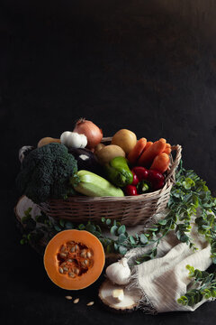 Wicker basket full of vegetables with a piece of pumpkin as the protag