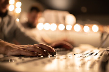 Cropped sound director recording music