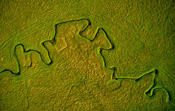 Curvy riverbed in green countryside