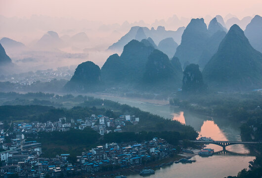 mist around limestone peaks in Yangshuo in Guangxi province / China