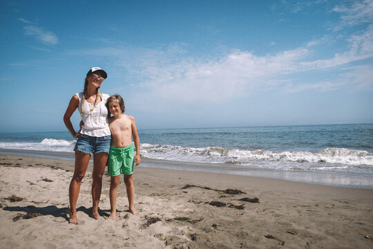 Mother and Son pose for a photo on a California Beach