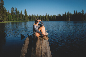 Blonde Woman on Sierra Lake Shields her Eyes from the Sun