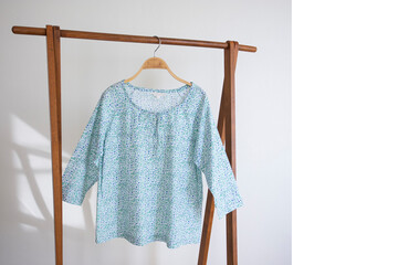  Woman blouse with blue blouse cotton on white background.