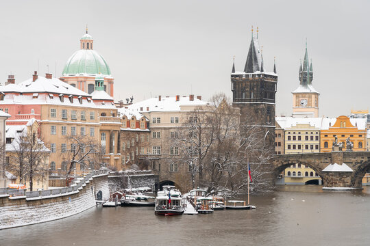 Old Town Bridge Tower and St. Francis of Assisi Church in winter, Prague, Czech Republic