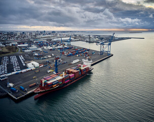 Cargo ship with containers in industrial port