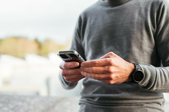 Close up of a man using smartphone