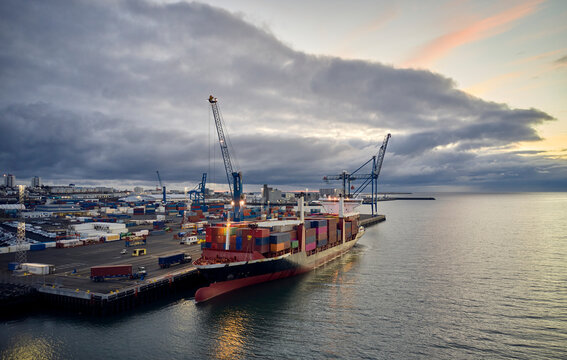 Freight port of city in dusk