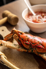 Closeup of a cooked crab on a wooden board