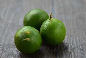 Citrus aurantiifolia, The Key lime.West Indian lime, bartender's lime, or Omani lime,  is a citrus hybrid and usually picked while it is still green, but it becomes yellow when ripe, high acidity