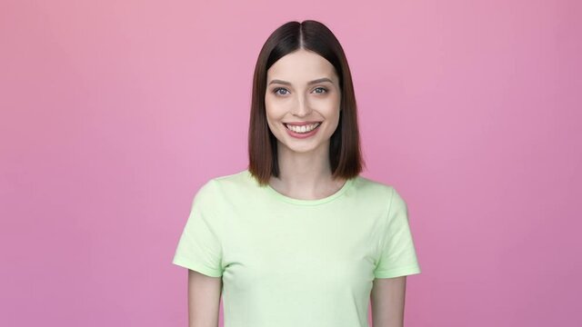 Adorable nice lady sending many air kiss isolated pink color background