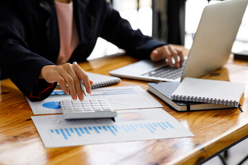 Fototapeta premium Business Woman working at office with documents on his desk, doing planning analyzing the financial report, business plan investment, finance analysis concept