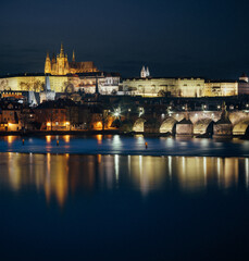 Fototapeta na wymiar night view of prague castle and st. vitus and cathedral bridge on ece vltava at night in the center of prague