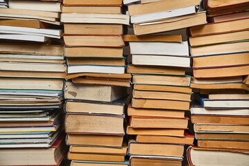 Wall of books piled up