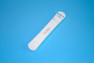 COVID-19 antigen test kit isolated on blue background. Negative result , ATK