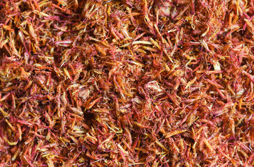 Fototapeta premium Dried safflower for herbal tea on background, dry safflower petals, Saffron substitute