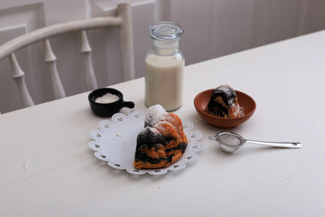 Marble Cake with Coffee with Powder Sugar and Kitchen Vintage Utensil, White Bakery Concept