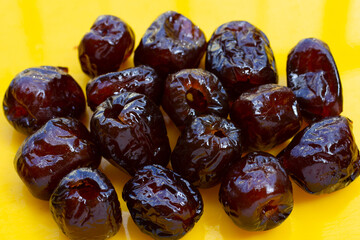 Sweet chinese jujube dessert on yellow background.