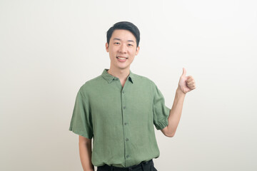 young Asian man thumbs up or ok hand sign