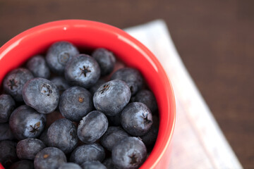 Blueberry fruit in red cup