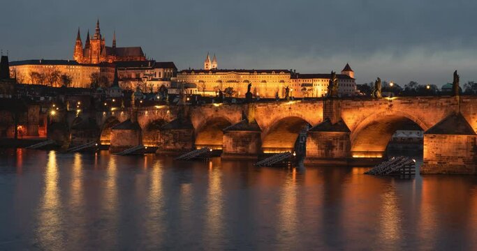 panoramic view of twilight and prague castle st. vitus cathedral and charles bridge in prague