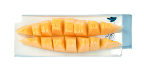 Orange cantaloupe melon fruit sliced on dish isolated on white background ,include clipping path