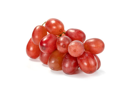 Closeup red seedless grapes isolated on white background