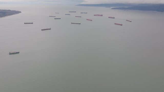 aerial footage of cargo ship backlog in the pacific ocean, Vancouver, British Columbia, Canada