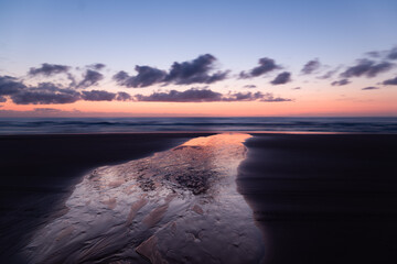 Fototapeta na wymiar Dawn reflections, Coastline K'Gari