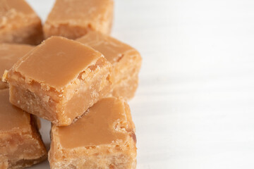 Close-Up Macro of Butterscotch Fudge on Light Table with Copy Space
