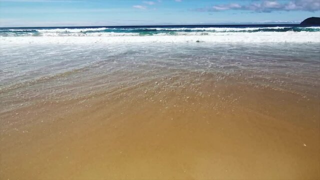 Beach at Bruny Island, Tasmania. Clear water, crushing wave. Great place for a vacation