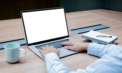 Businessman put your hand on keyboard and white screen background mock up on display laptop with clipping path