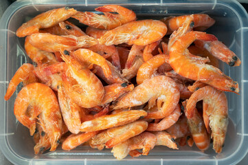 Frozen shrimp in fridge at the fish market. Healthy eating and fish market concept