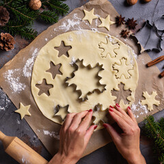 Christmas cooking and baking, female hands making cookies from dough