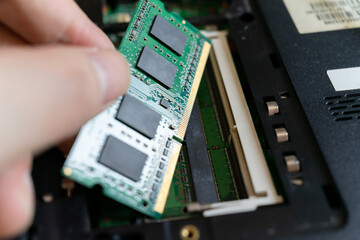 Repairmen are replacing ram for laptop