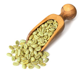Green coffee beans in the wooden scoop, isolated on white background