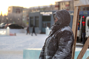 A portrait of a fitter with a hood on his head
