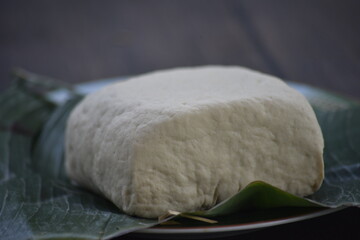 Tofu, also known as bean curd or Tahu in Indonesia language, is a food prepared by coagulating soy milk fermentation and then pressing the resulting curds into solid white blocks of varying softness 