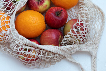 basket of apples and oranges