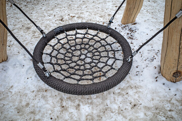 A fragment of a children's attraction in the park on a cold winter day