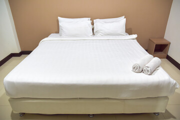 white bed in hotel room