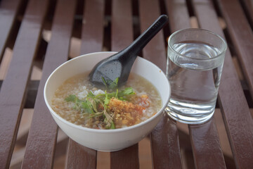 Cook the minced pork congee on the table ready to eat. Choose focus and blur according to the lens character.