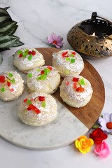 Rasmalai or Malai Sandwich, Roshmolai, Rasamalei is very popular Indian dessert. A sweet malai stuffing inside Rasgulla. It's a sweet delicacy made with Indian cottage cheese or chenna. Copy space.