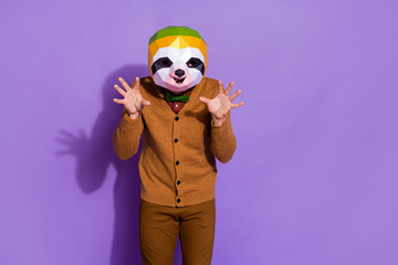 Photo of wacky slow sloth mask person arms palms make claws isolated on purple color background